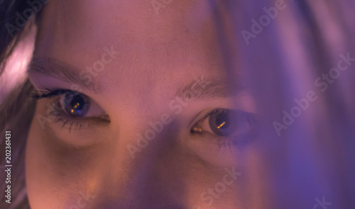 Close-up image of young woman blue eyes