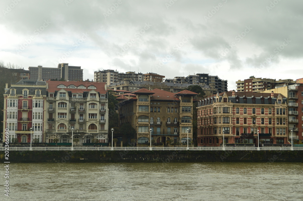 Old And Historical Buildings Of 1900 Beginnings Viewed From Portugalete To Sunrise. Architecture History Travel. March 25, 2018. Bridge of Getxo Vizcaya Basque Country Spain.