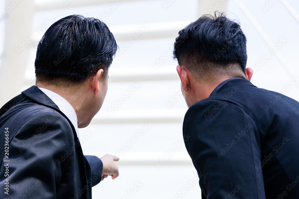 The asian businessman has pointing and looking to forward, The asian businessman has pointing and looking to forward,