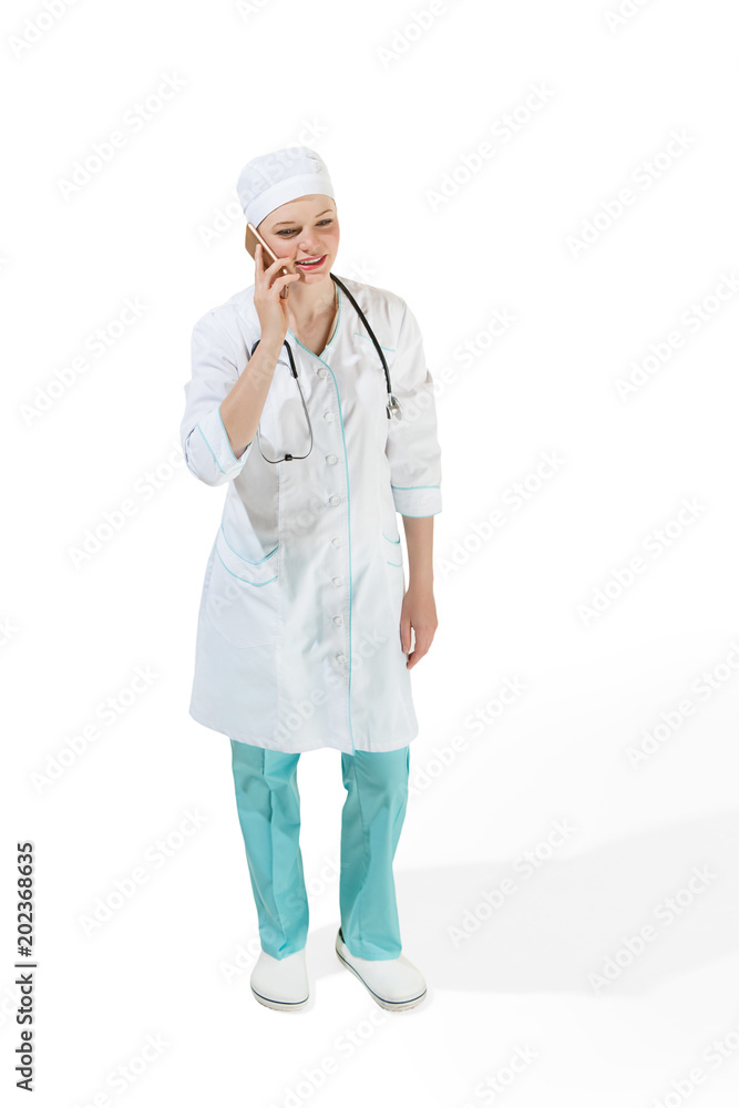 Beautiful young woman in white coat posing at studio. Full length studio shot isolated on white. Beautiful young woman in white coat posing at studio. Full length studio shot isolated on white.
