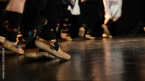 Group of dancers in traditional costumes. Folklore performance at festival. Kolo, traditional Balkans folk dance.  photo