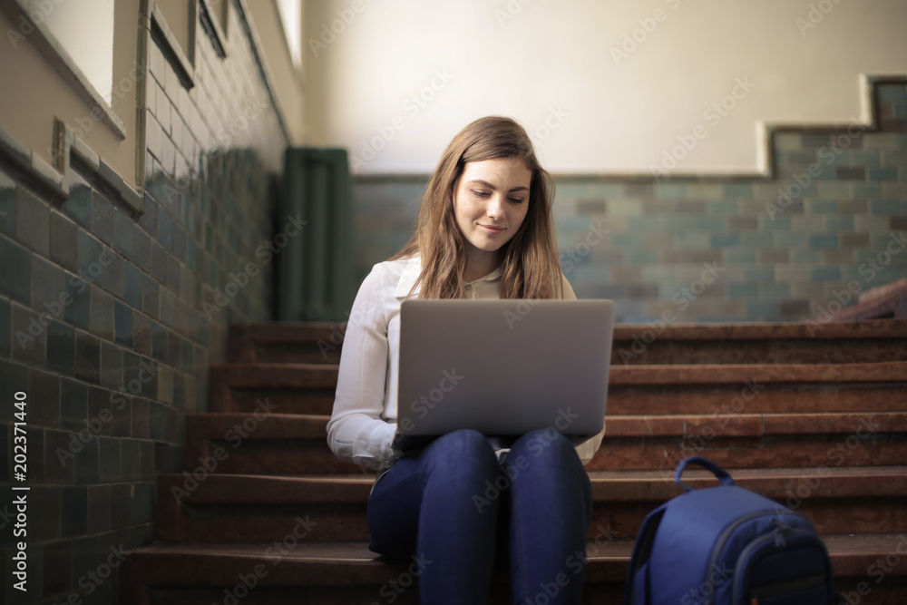 Young student sitting on the stairs Young student sitting on the stairs
