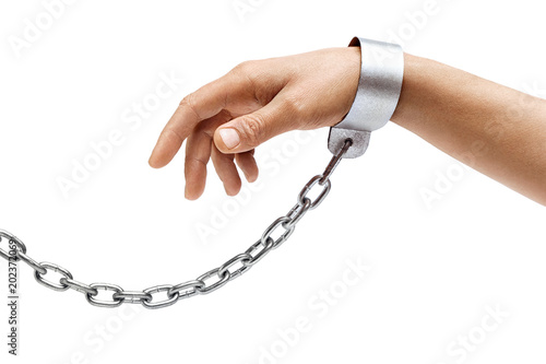 Fototapeta Man's hand in chains isolated on white background