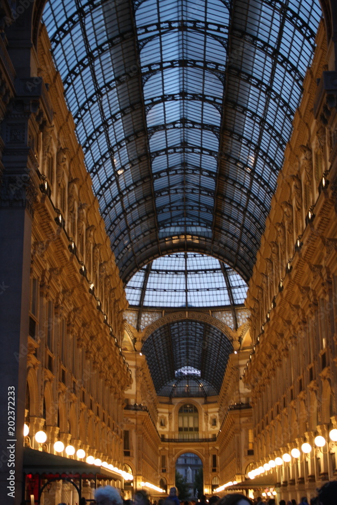 Night scene of Vittorio Emanuele II Gallery in Milan, Italy