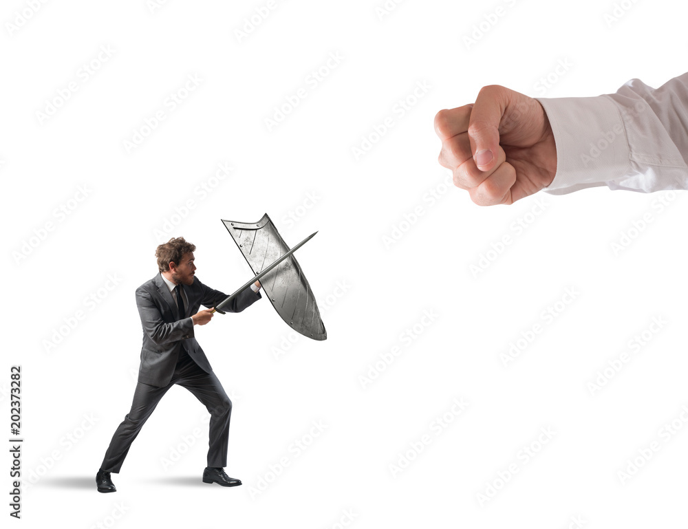 Φωτογραφία Little business man challenges big problems fighting with shield and sword