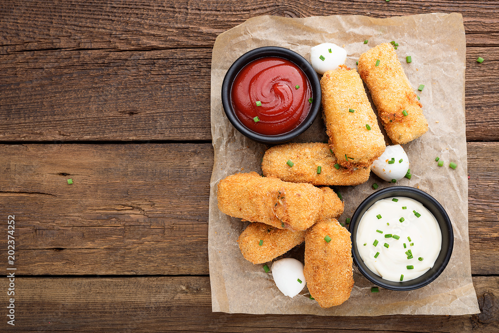 Fotografie Delicious fried mozzarella cheese sticks. top view.