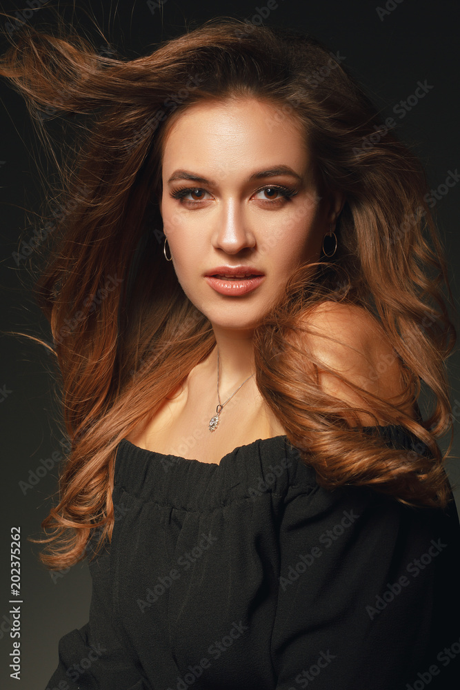 Stylish beauty portrait of a fashionable girl with makeup and hair Stylish beauty portrait of a fashionable girl with makeup and hair