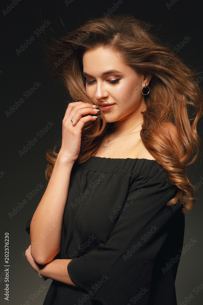 Stylish beauty portrait of a fashionable girl with makeup and hair Stylish beauty portrait of a fashionable girl with makeup and hair