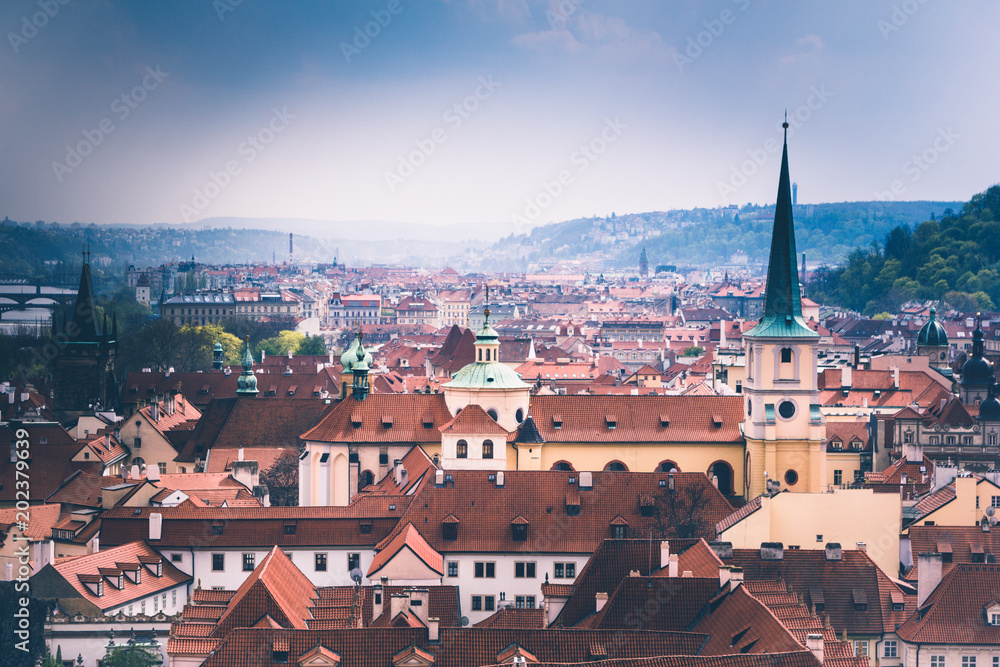 Panoramic view of Prague roofs and domes. Czech Republic. Europe. Filtered image:cross processed retro effect.
