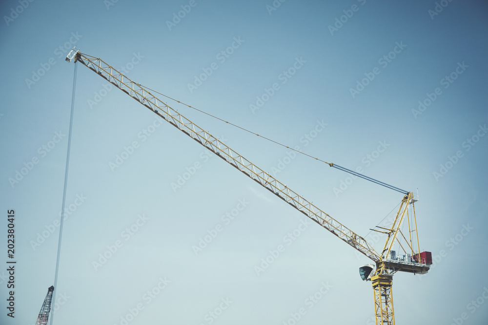 part of arm machinery construction crane with blue sky background part of arm machinery construction crane with blue sky background