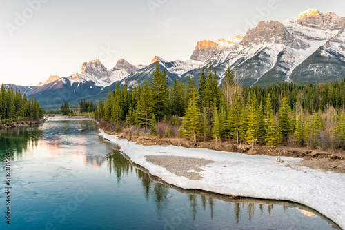 Sun rise over the Bow river and Rockies, Canmore, CanadaSun rise over the Bow river and Rockies, Canmore, CanadaSun rise over the Bow river and Rockies, Canmore, Canada photo