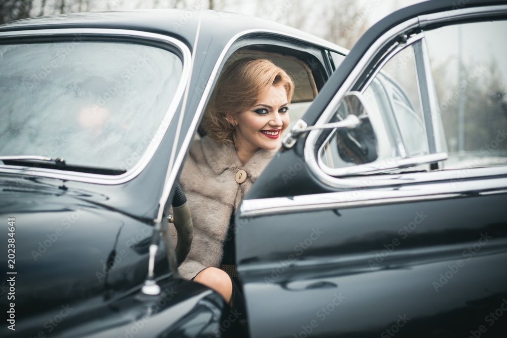 Retro collection car and auto repair by driver. sexy woman in fur coat. Travel and business trip or hitch hiking. Escort and security guard for luxury woman. Call girl in vintage car
