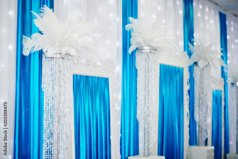 Obraz premium Magic wedding decor on the tables of the bride and groom, white and blue color, beautiful details, selective focus