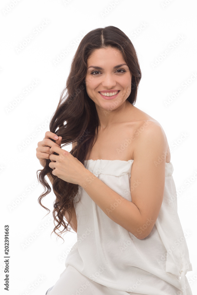 Half length image of sexy brunette in white dress touching her healthy  curlu hair. Beauty concept. Mid age woman over 35 years old beauty concept.  Stock Photo | Adobe Stock