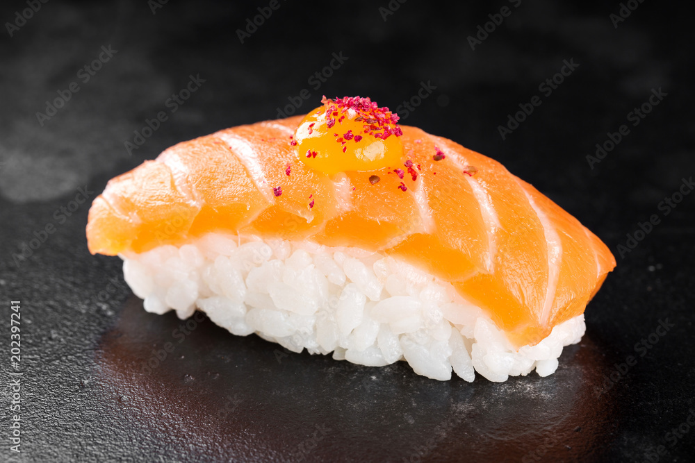 Sushi nigiri with salmon on black background Sushi nigiri with salmon on black background
