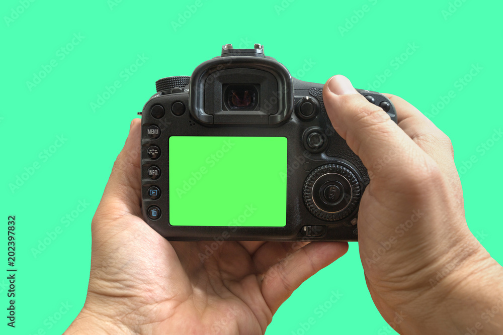 Camera in hands on isolated green screen, path included Camera in hands on isolated green screen, path included