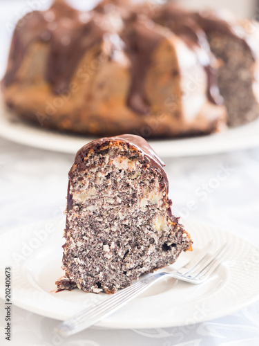 Obraz na płótnie Flourless gluten and sugar free Easter gugelhupf cake with banana, poppy seeds and chocolate icing w salonie