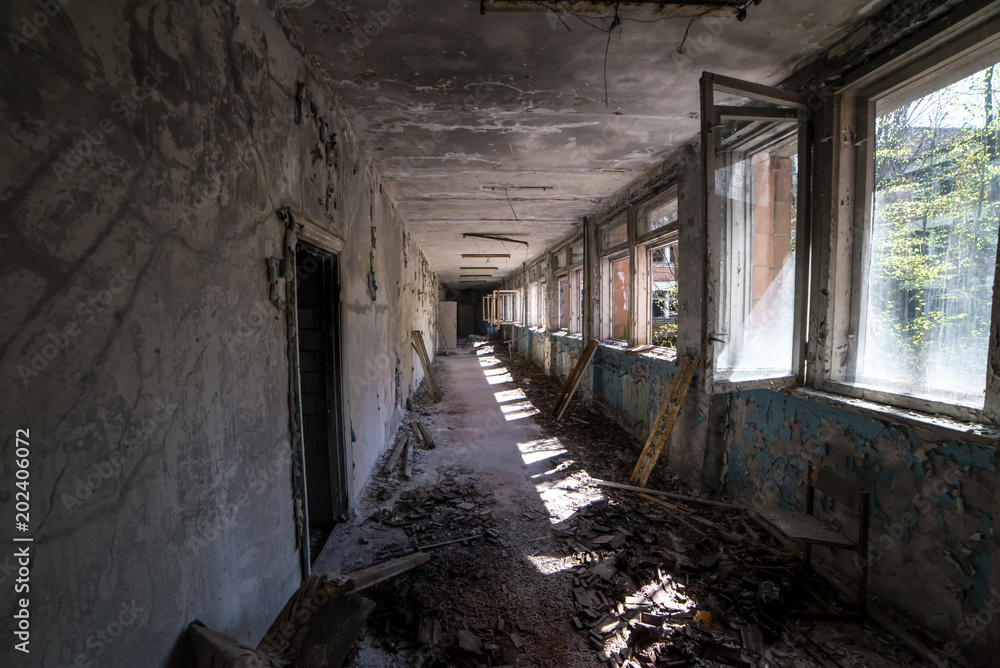 Corridor of abandoned middle school in Pripyat city in Chernobyl Exclusion Zone, Ukraine Corridor of abandoned middle school in Pripyat city in Chernobyl Exclusion Zone, Ukraine
