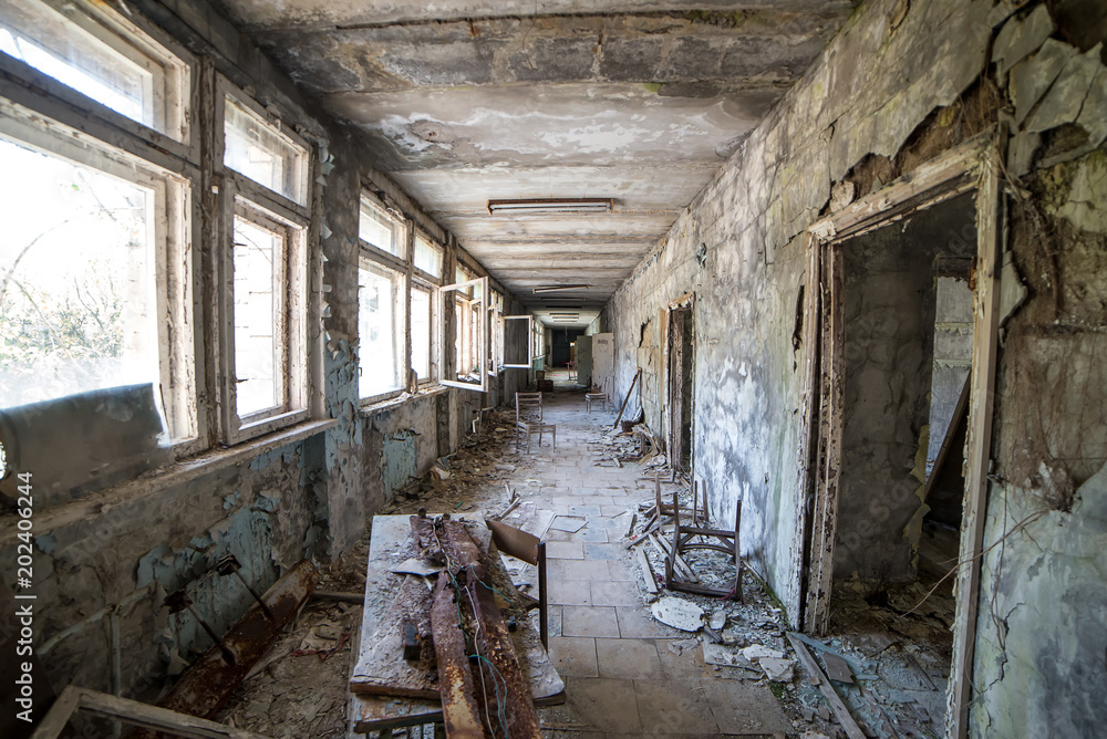 Corridor of abandoned middle school in Pripyat city in Chernobyl Exclusion Zone, Ukraine