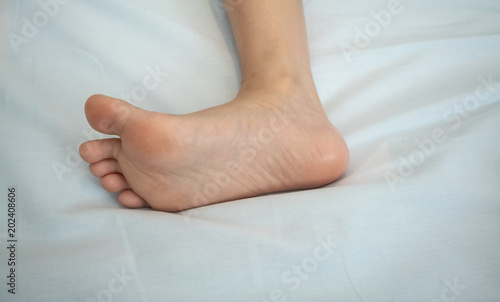 Children's bare foot. Child's bare foot on white