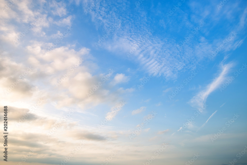 blue sky background with white clouds sunset.
