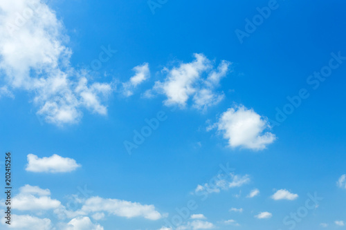 blue sky background with white clouds.