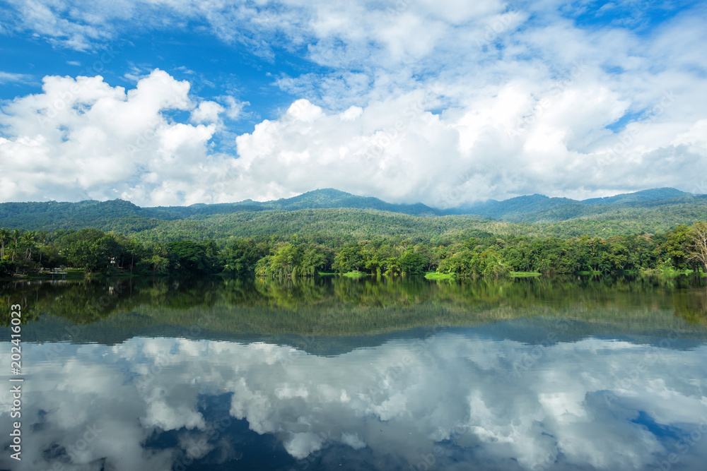 Mountain range forest with the reservoir blue sky background in Ang Kaew Chiang Mai University,Thailand.