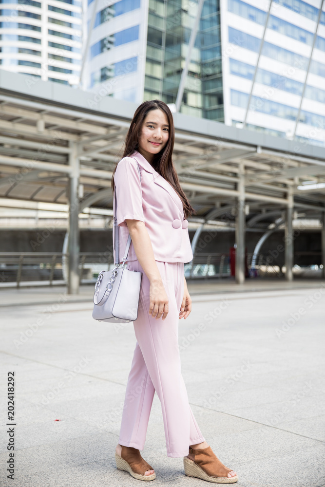 Fototapeta premium Young asian business woman outdoors