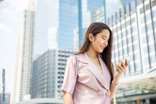 Young asian business woman outdoors