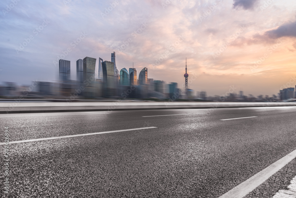 cityscape and skyline of shanghai from empty asphalt road. - obrazy, fototapety, plakaty 