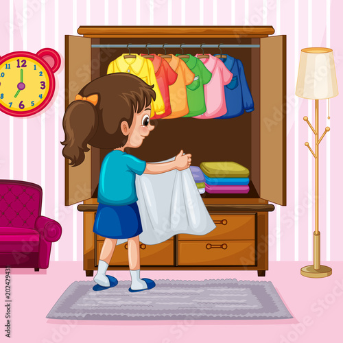 A Girl Folding Cloth in Wardrobe