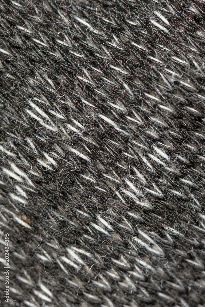 Black and white threads on the fabric Black and white threads on the fabric