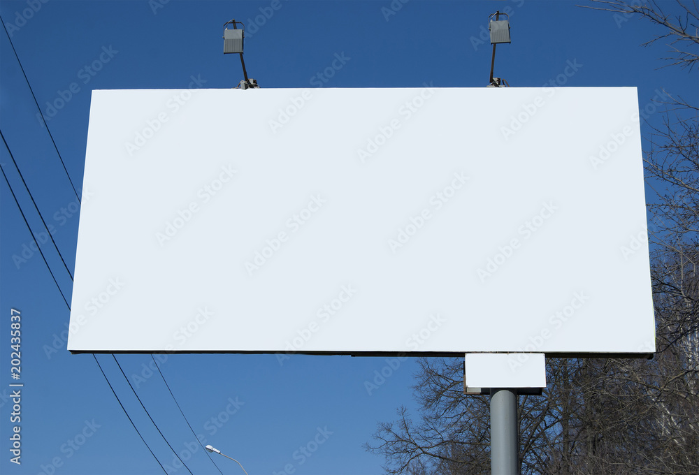 A billboard in the daytime on the street, not filled with information. Template for advertising. A billboard in the daytime on the street, not filled with information. Template for advertising.