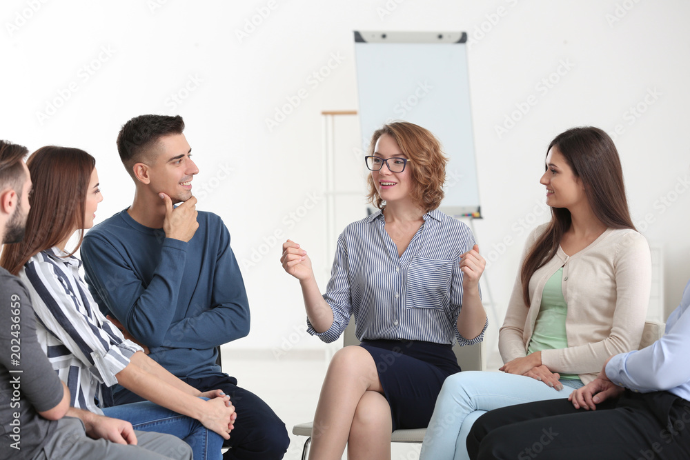 People at group psychotherapy session indoors People at group psychotherapy session indoors