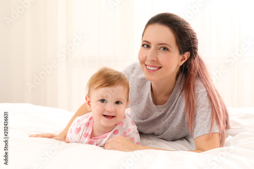 Young mother and her cute b...