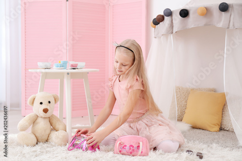 Cute girl dressed as little...