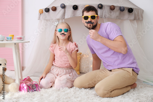 Cute little girl and her fa...