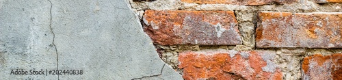 Banner of old vintage brick wall with concrete Weathered texture of racked concrete vintage brick wall background
