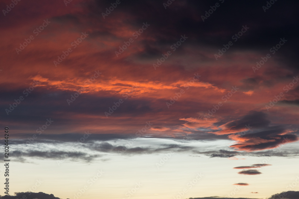 Beautiful red clouds at sunset, making abstract shapes