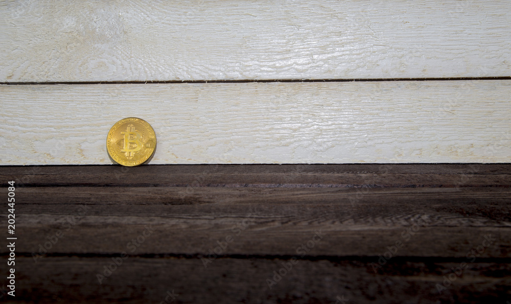 Shiny Golden Bitcoin on wooden background,Cryptocurrency concept Shiny Golden Bitcoin on wooden background,Cryptocurrency concept