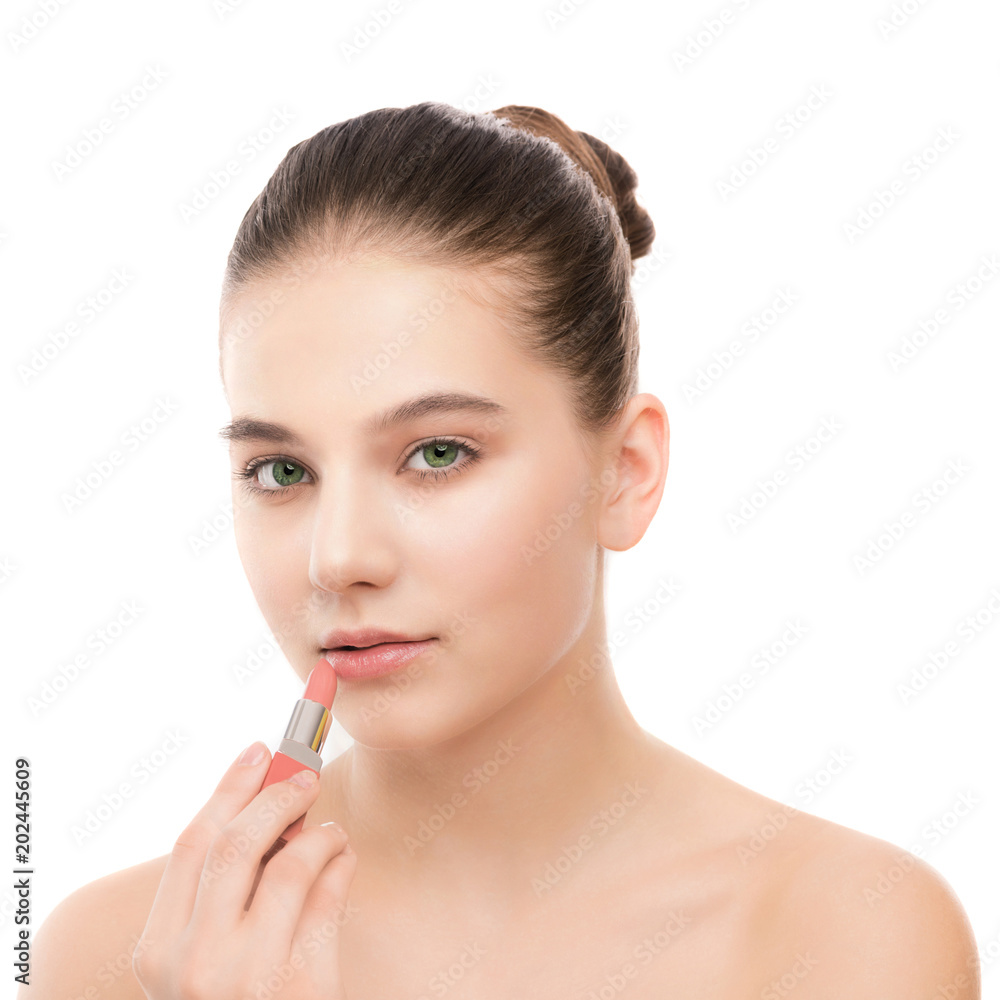 Portrait of beautiful young brunette woman with clean face. Beauty spa model girl with perfect fresh clean skin applying lipstick. Youth and skin care concept. Isolated on a white background. Portrait of beautiful young brunette woman with clean face. Beauty spa model girl with perfect fresh clean skin applying lipstick. Youth and skin care concept. Isolated on a white background.