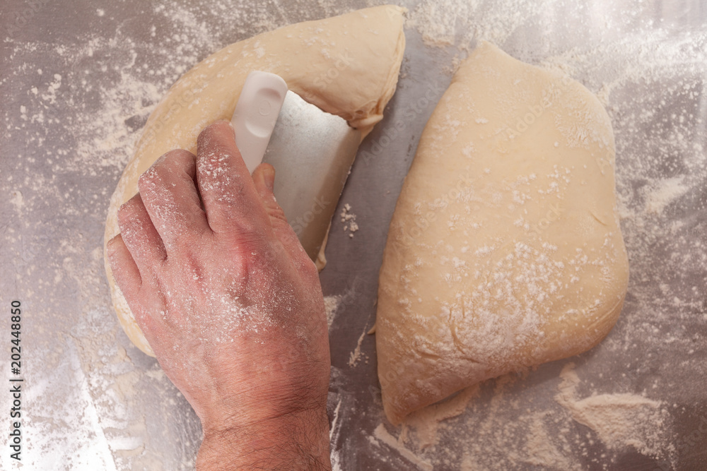 Fototapeta premium Hand shaping and preparing bread