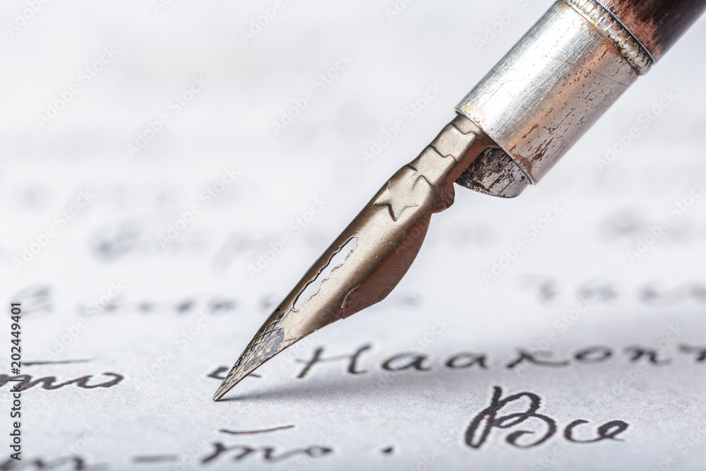 Fototapeta premium Fountain pen on an antique handwritten letter