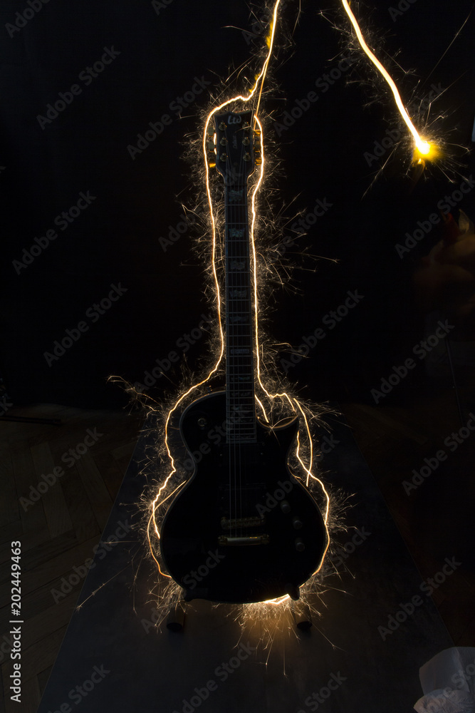 Fotografie Sparkling electric guitar silhouette