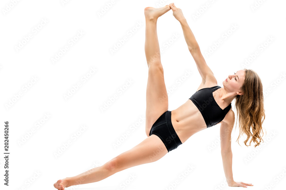 slender sportswoman doing yoga and stretching on white background