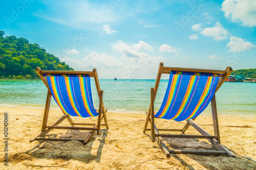 Beautiful tropical beach and sea with coconut palm tree in paradise island