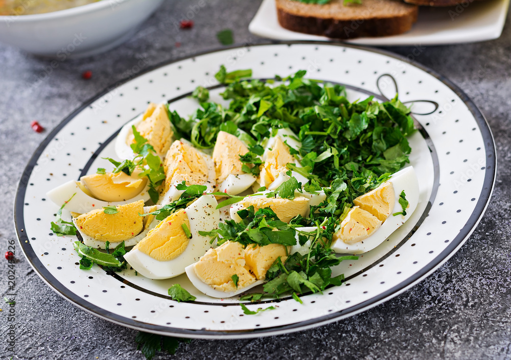 Boiled eggs with greens. Healthy food. Summer salad Boiled eggs with greens. Healthy food. Summer salad