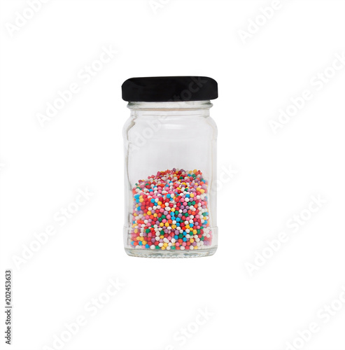 colorful sprinkles in bottle isolated on white background