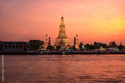 Wat Arun Temple at sunset twilight with floating lanterns in bangkok,Thailand.