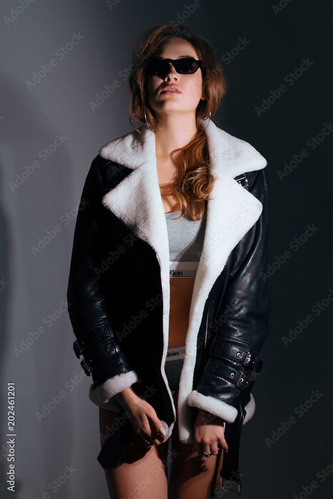 Stylish beauty portrait with glasses of a fashionable girl with makeup and hair Stylish beauty portrait with glasses of a fashionable girl with makeup and hair